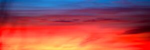 Solnedgang bak skyene, fotokunst veggbilde / plakat av Peder Aaserud Eikeland