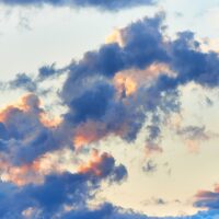 Solnedgang bak skyene, fotokunst veggbilde / plakat av Peder Aaserud Eikeland