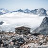 Steinbu med utsikt over Jotunheimen, fotokunst veggbilde / plakat av Tor Arne Hotvedt